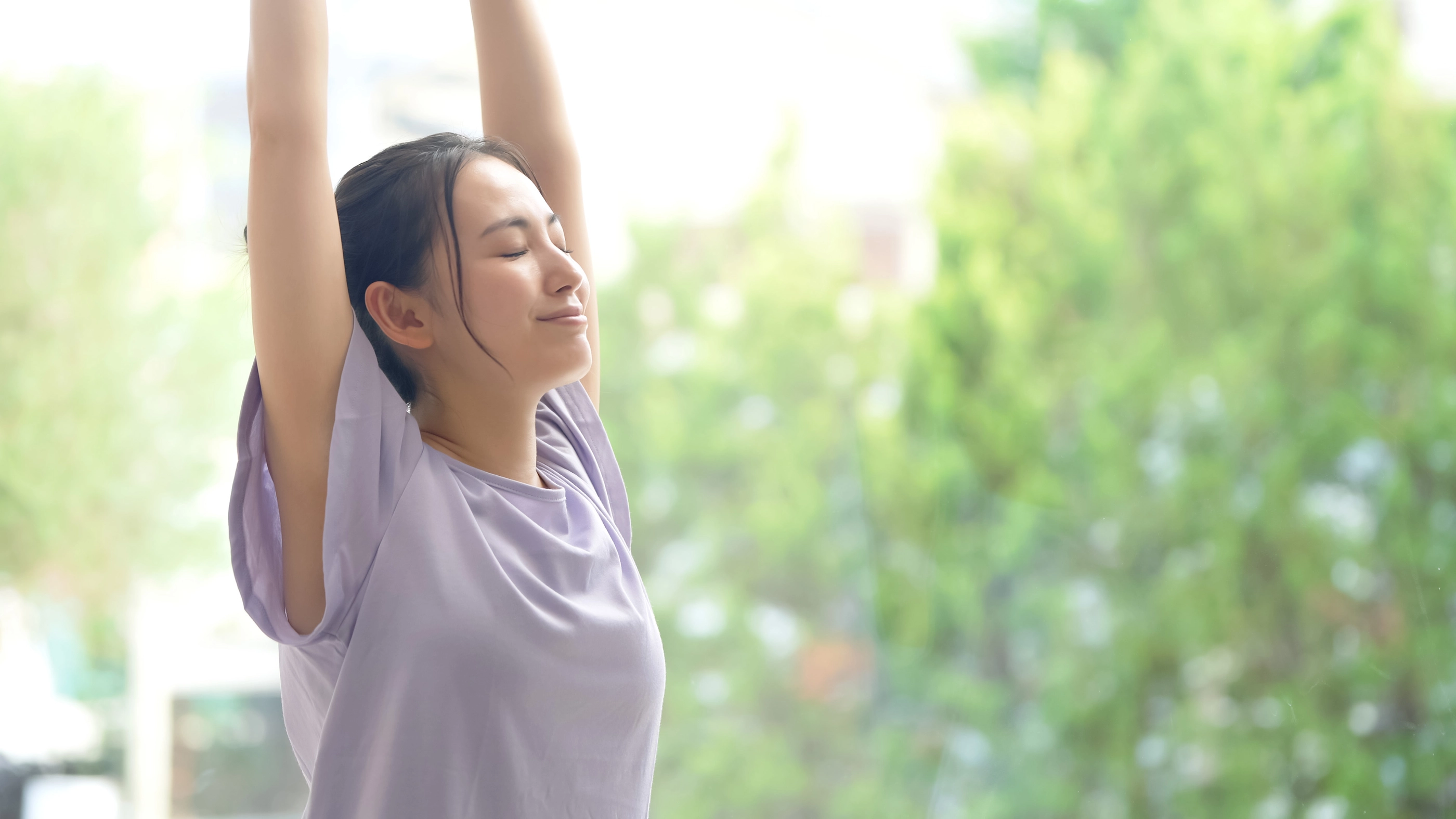 Young asian woman doing stretch. Health care. Body care.; Shutterstock ID 1921190279; purchase_order: NFI; job: ; client: ; other: 